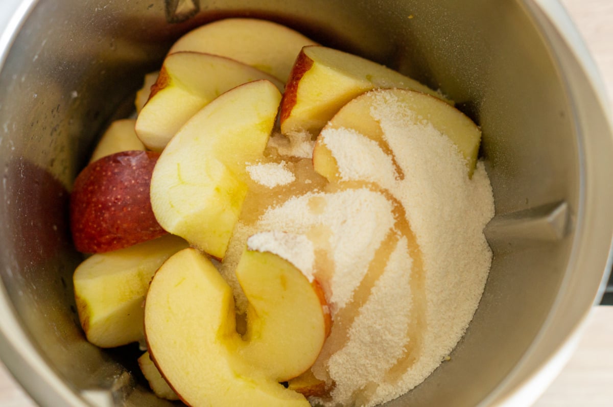 Apples in the Thermomix® mixing bowl with sugar and lemon
