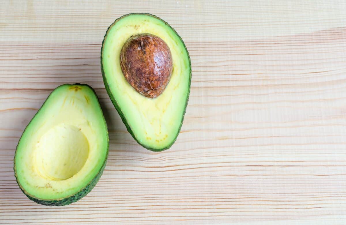Halving an avocado and removing the stone