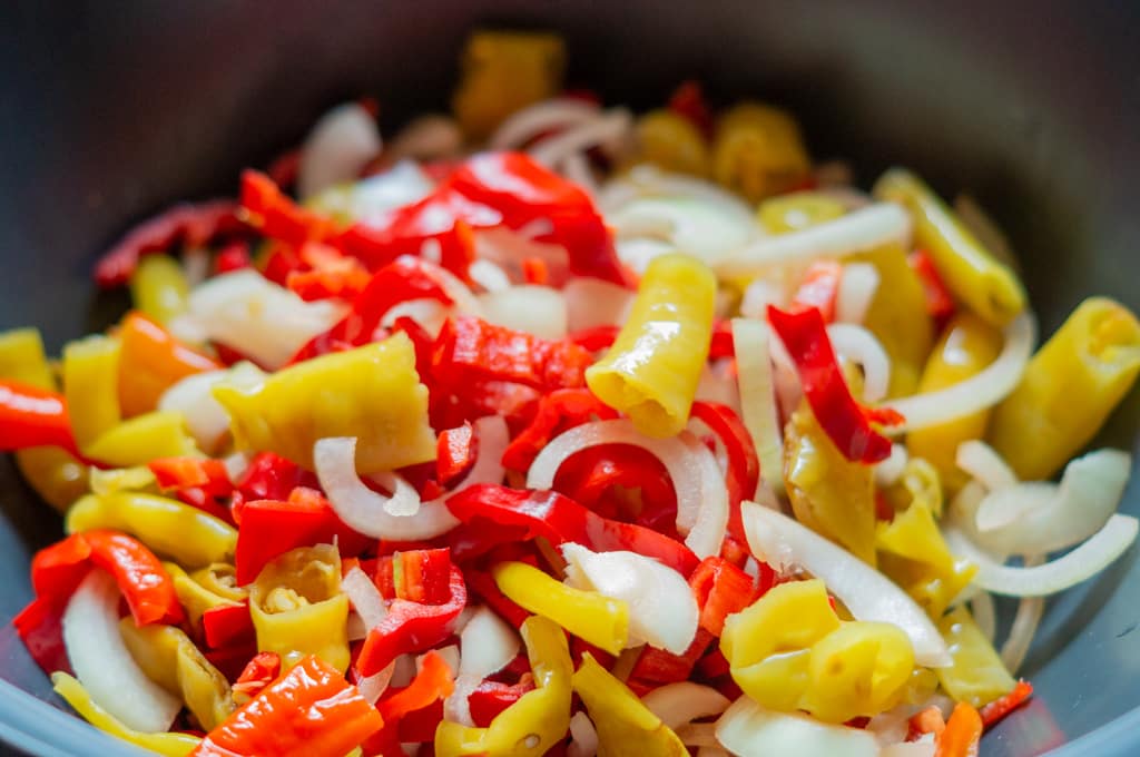 Pointed peppers, pepperoncini and onions cut into pieces