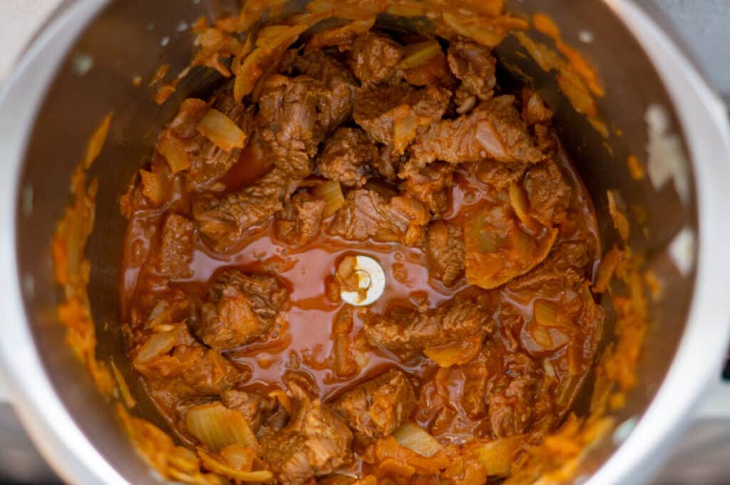 Beef being sweated in the Thermomix® mixing bowl