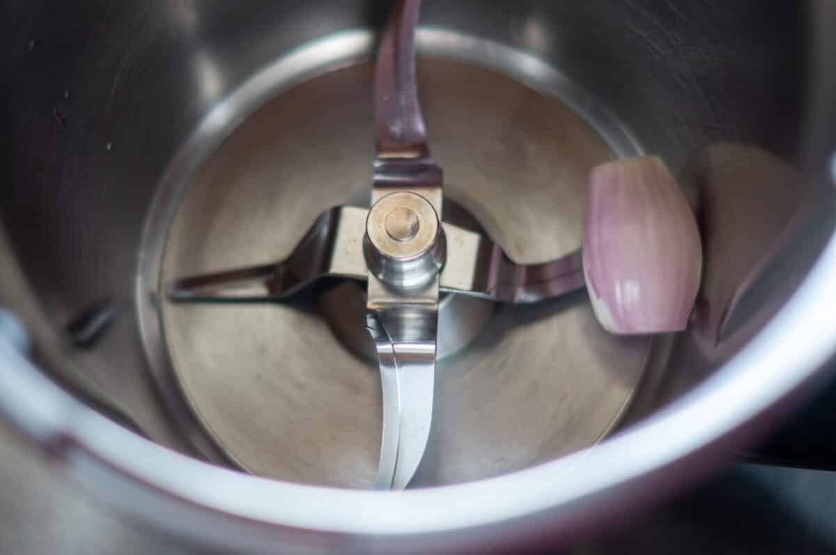 Chopping a shallot in the mixing bowl