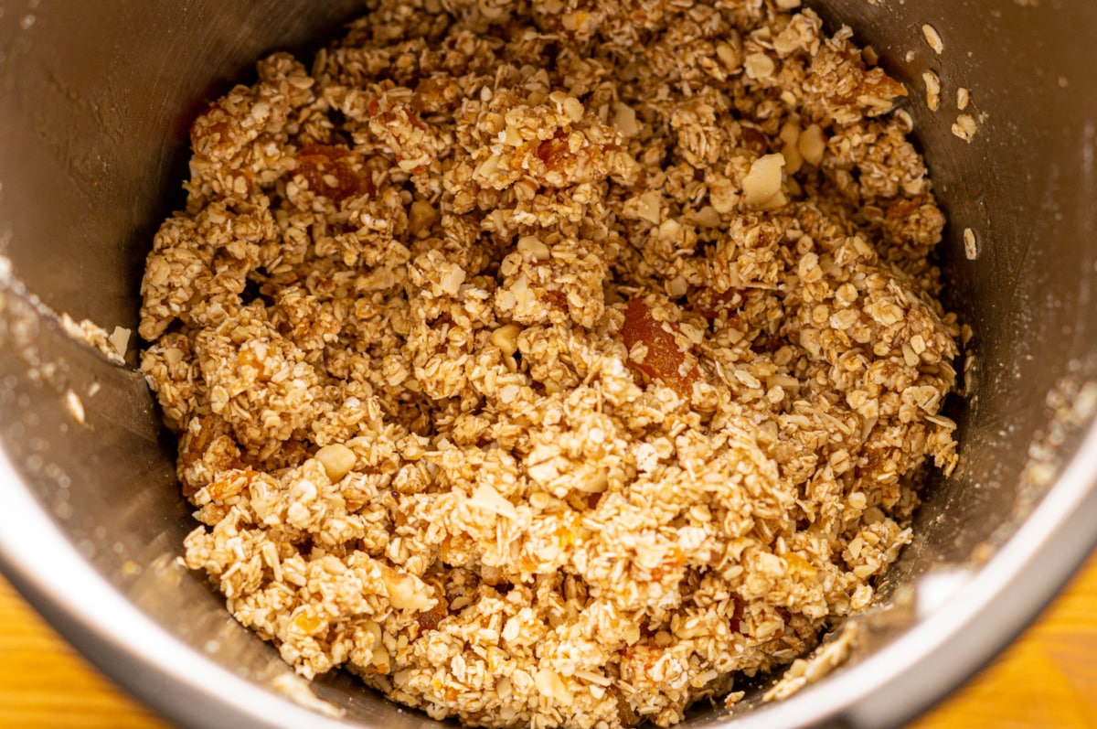 Combining the honey and spice mixture with oats and nuts