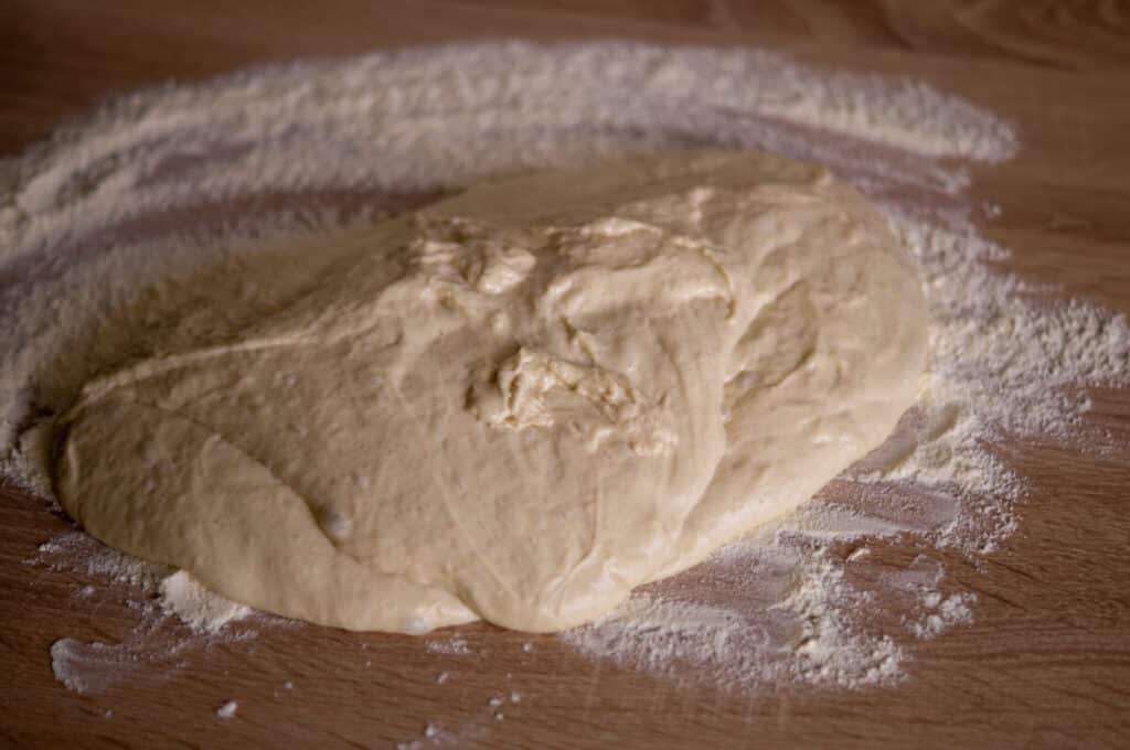 Ciabatta dough on a floured work surface