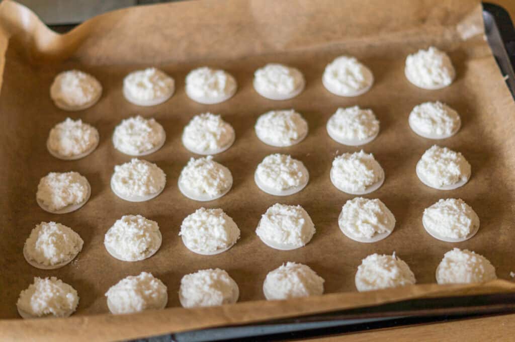Coconut macaroons on the baking tray before baking