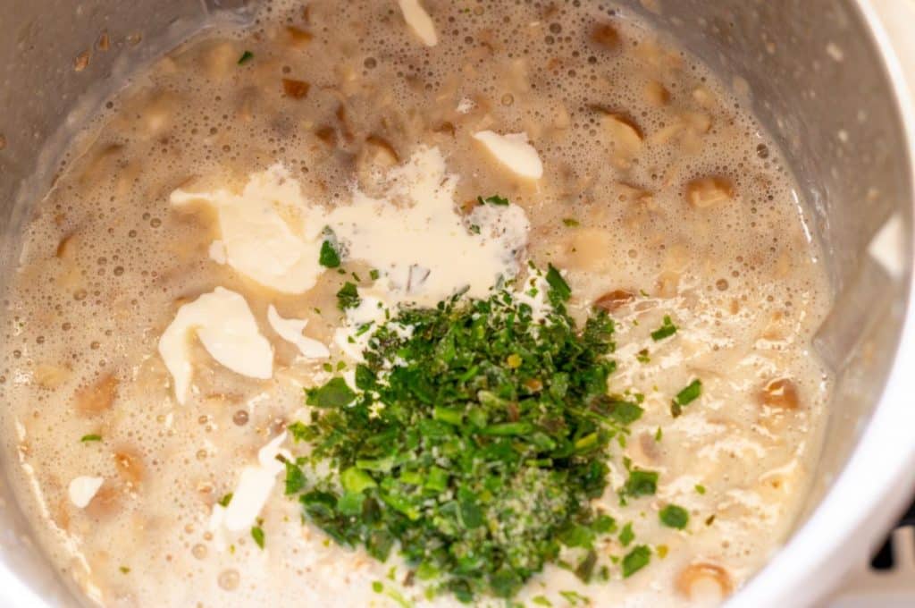 Freshly cooked mushroom soup in the Thermomix® mixing bowl