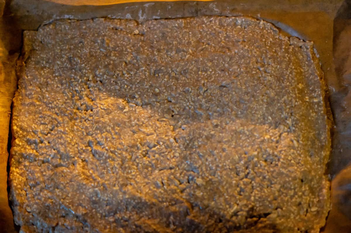 Spreading crispbread dough on a baking tray