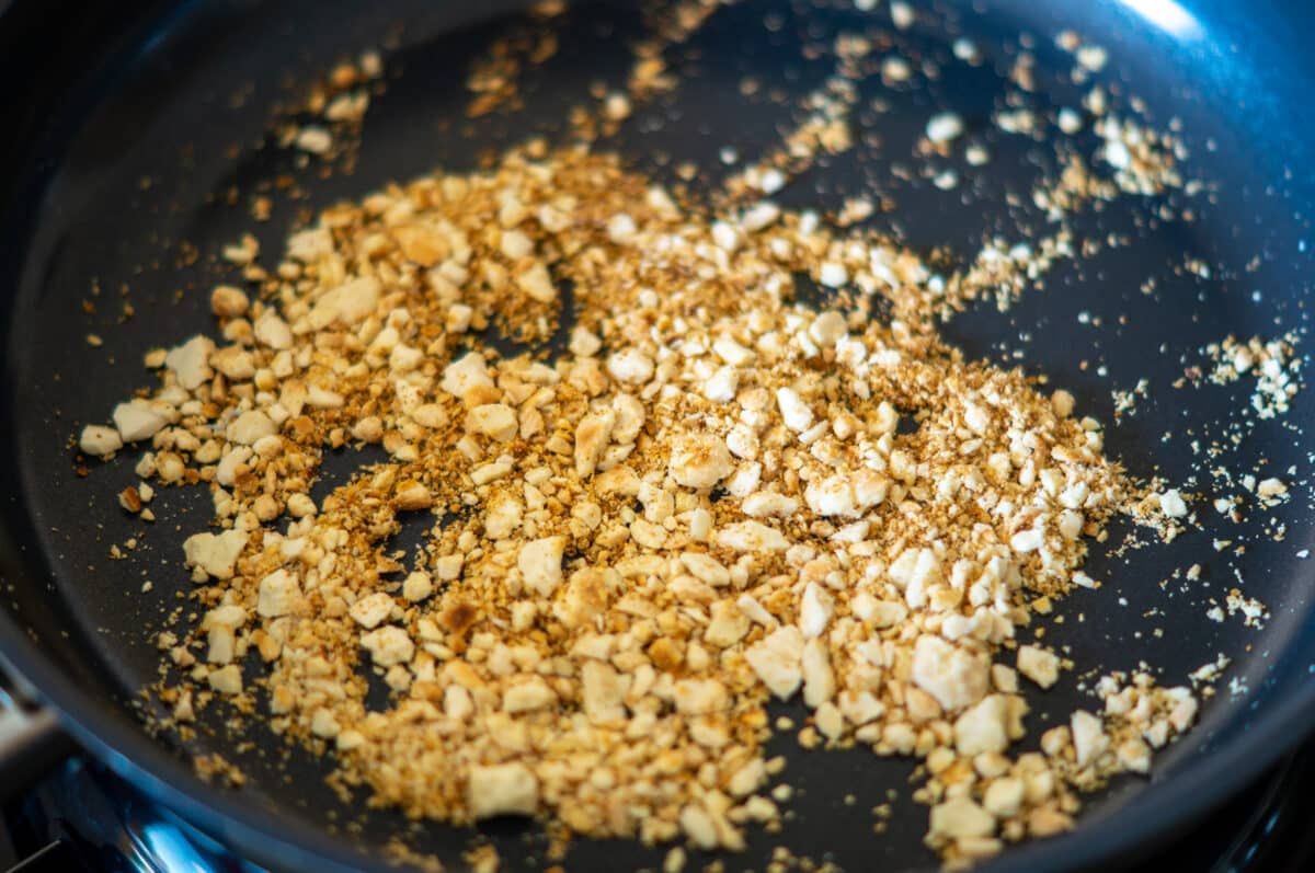 Toasting almonds in a frying pan