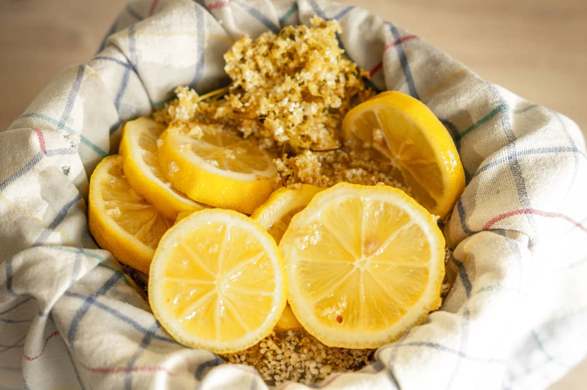 Straining Thermomix® elderflower cordial through the simmering basket