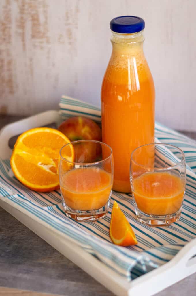 Healthy ginger orange shot made with the Thermomix® in a bottle
