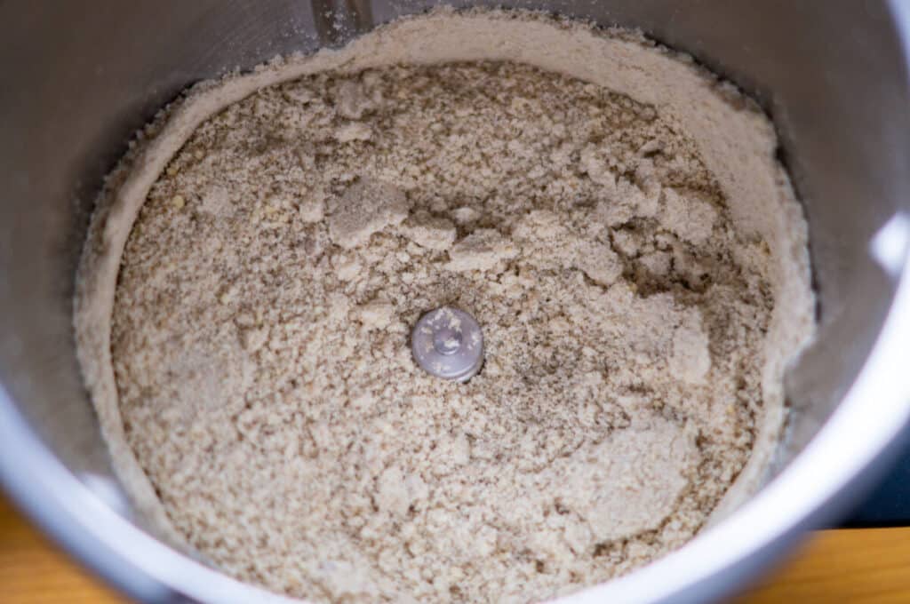 Milling almonds and sunflower seeds in the mixing bowl