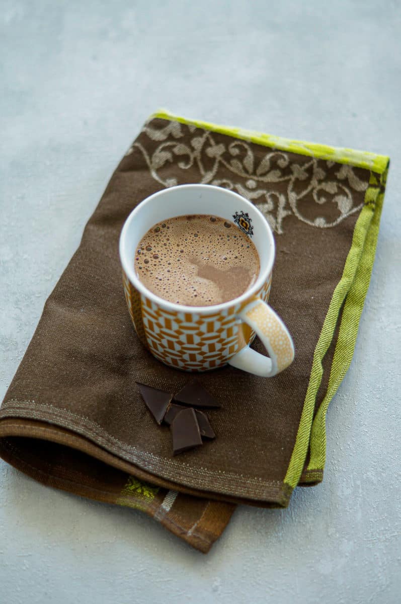 Hot chocolate made in the Thermomix® in a mug with chocolate sprinkles