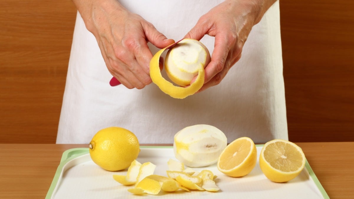 Peeling a lemon thinly for limoncello, only the yellow peel without white pith