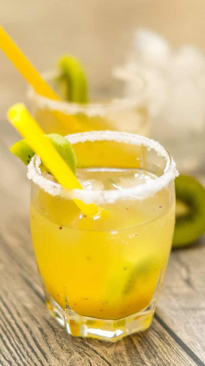 Mango kiwi cocktail made with the Thermomix®, with a sugar rim and straw