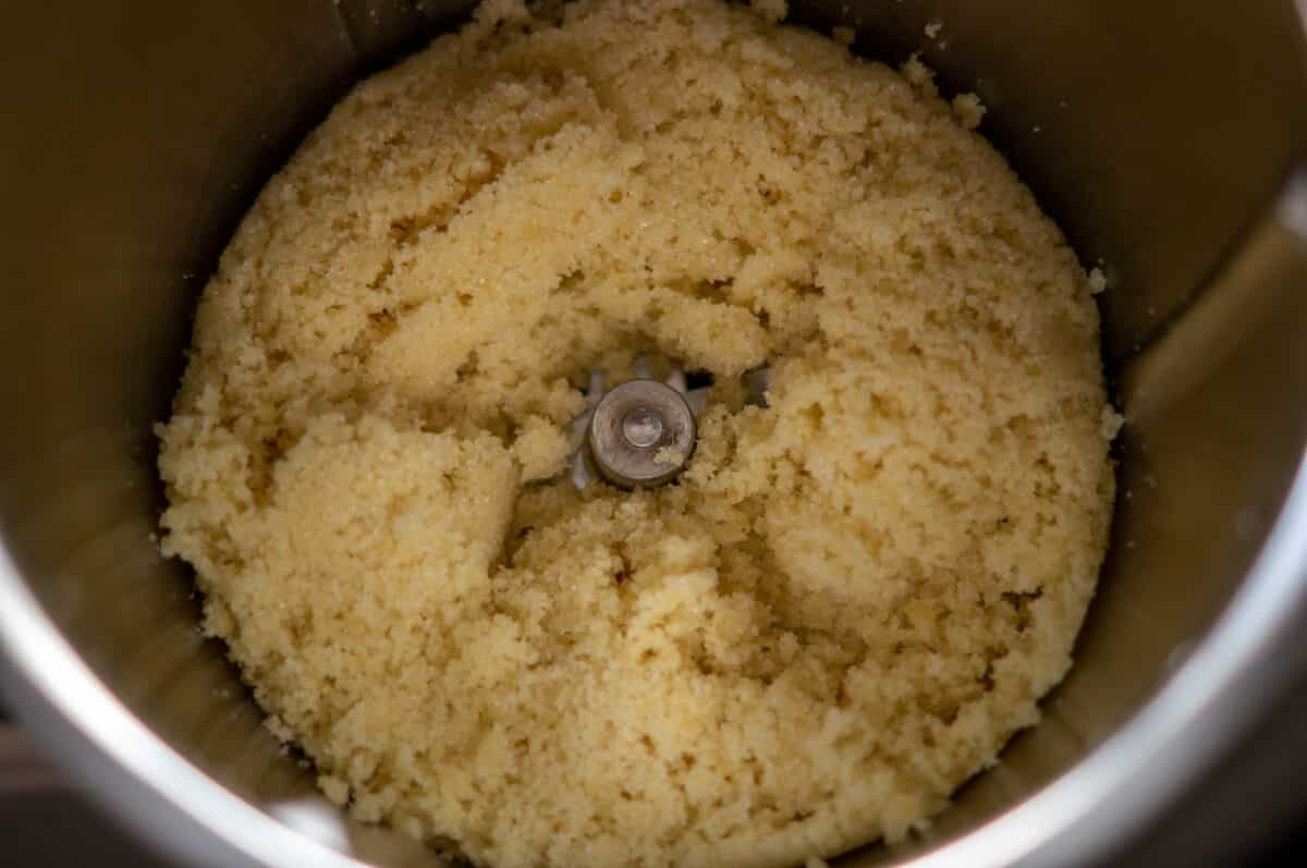 Marzipan finely chopped in the Thermomix® mixing bowl