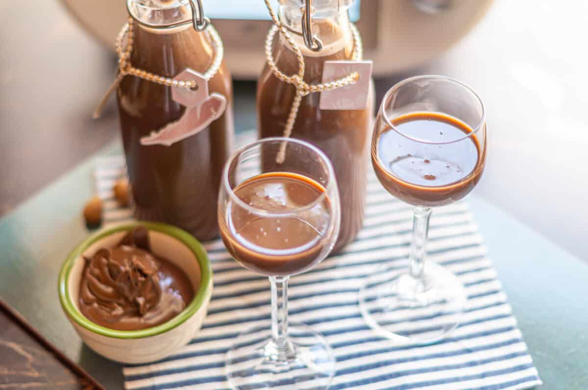 Nutella® liqueur made with the Thermomix® in a bottle with a glass