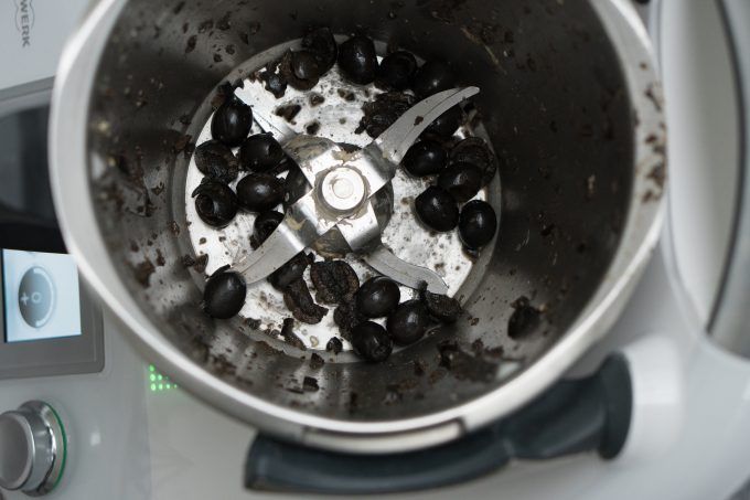 Chopping olives and sun-dried tomatoes in the mixing bowl