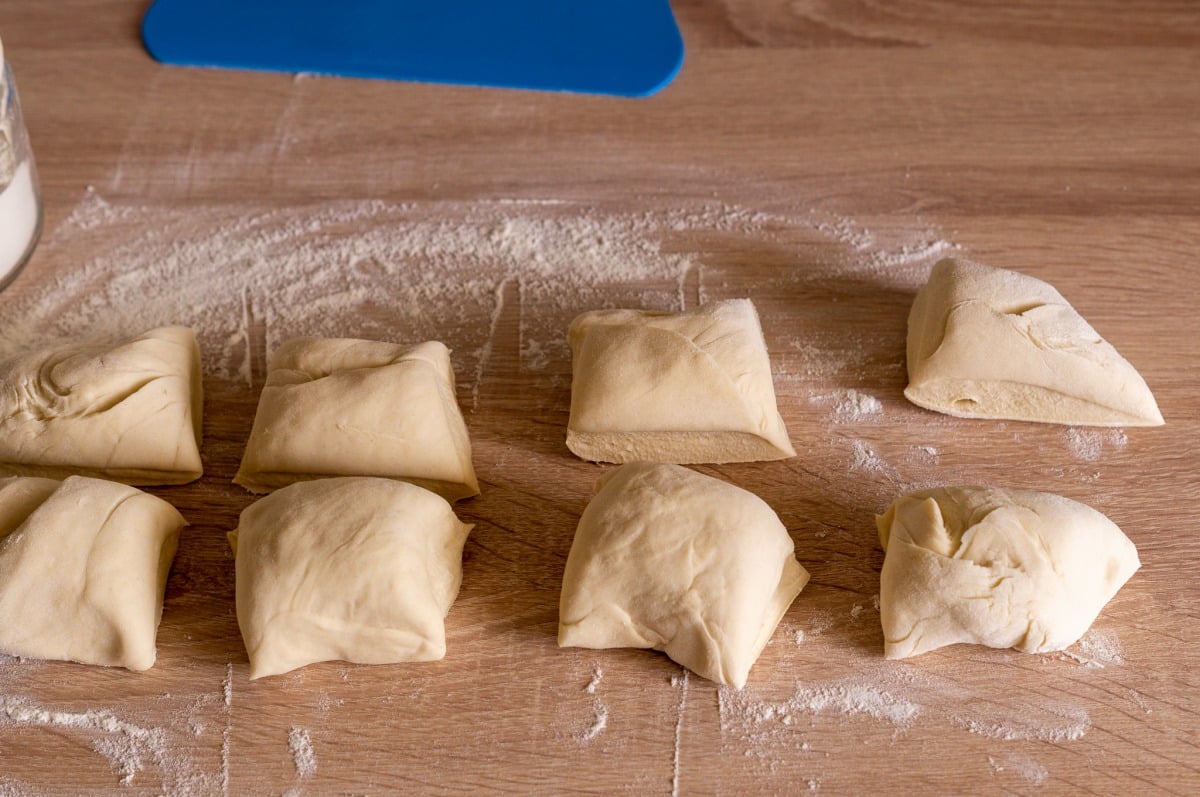 Dividing dough into rolls on a work surface