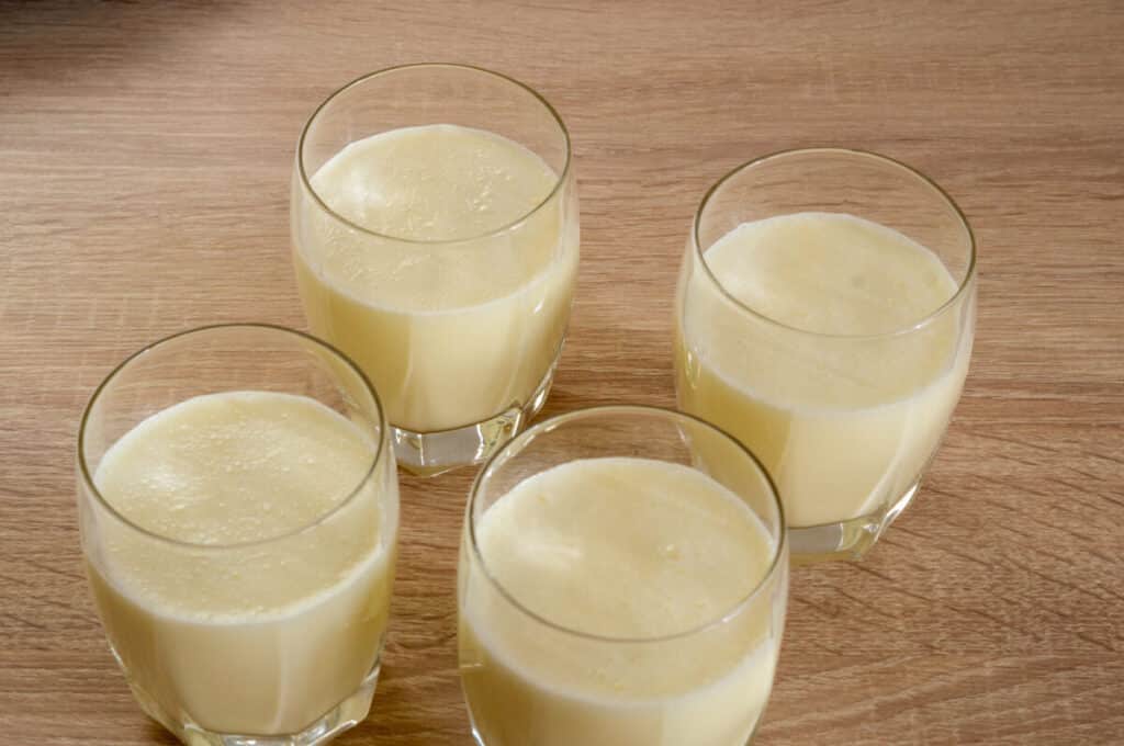 Pouring Panna Cotta into dessert glasses