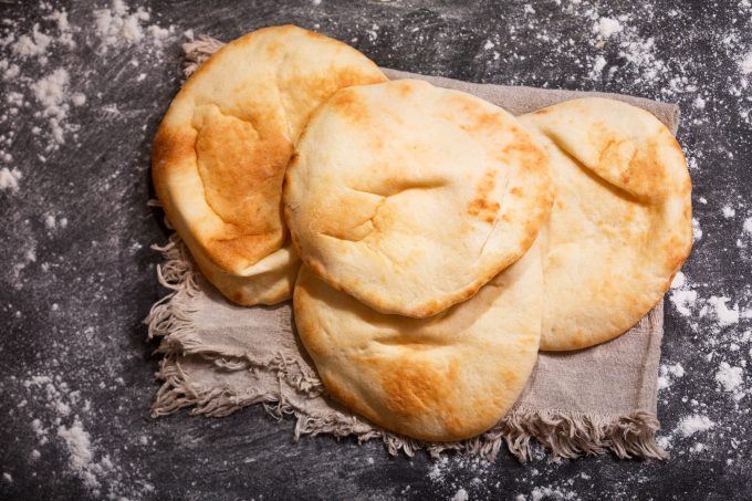 Pitta bread baking in the oven