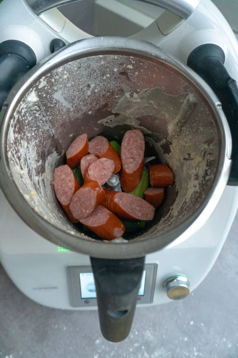 Chopping the leek and sausage