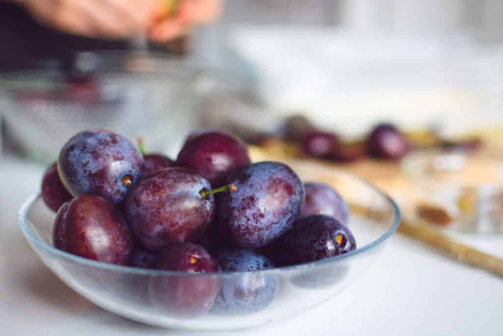 Halved, stoned plums ready for the Thermomix®