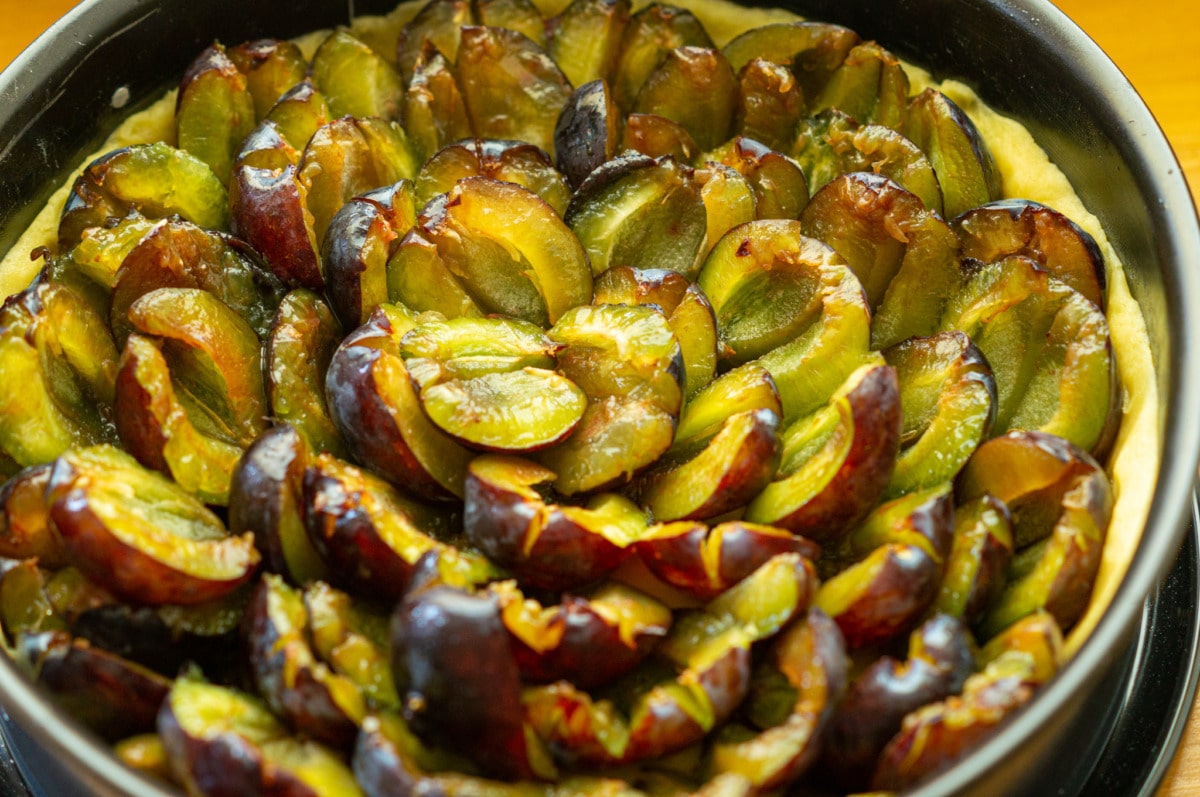 Pastry base covered with plums