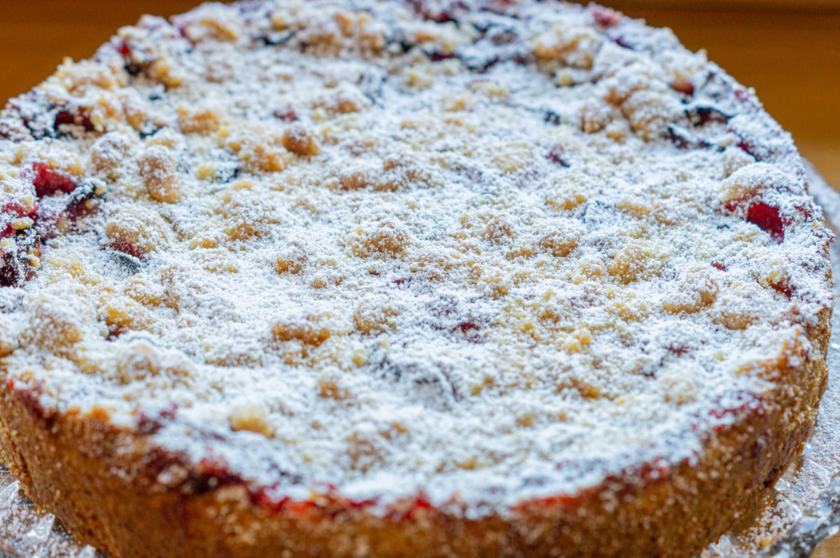 Plum cake dusted with icing sugar before serving