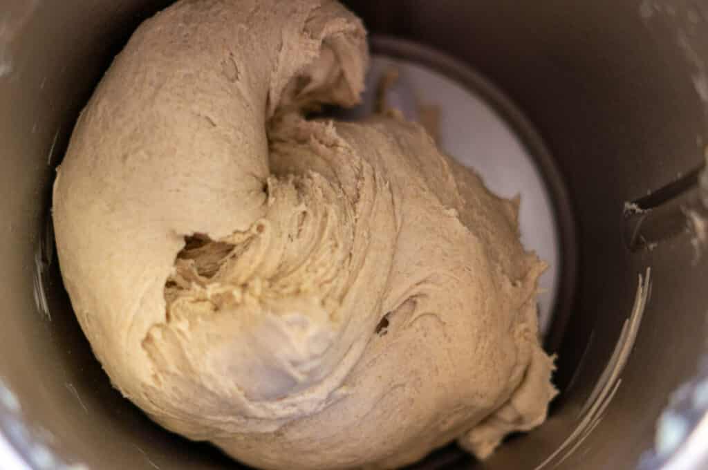 Potato roll dough being kneaded in the mixing bowl