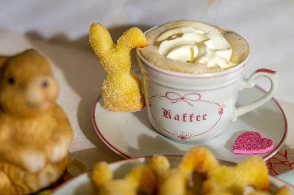 Quark oil Easter bunnies served with a cappuccino
