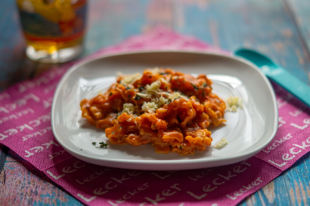 Quick favourite tomato pasta from the Thermomix® in a bowl with Parmesan
