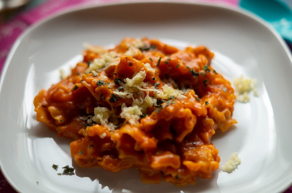 Tomato pasta from the Thermomix® plated with Parmesan and basil