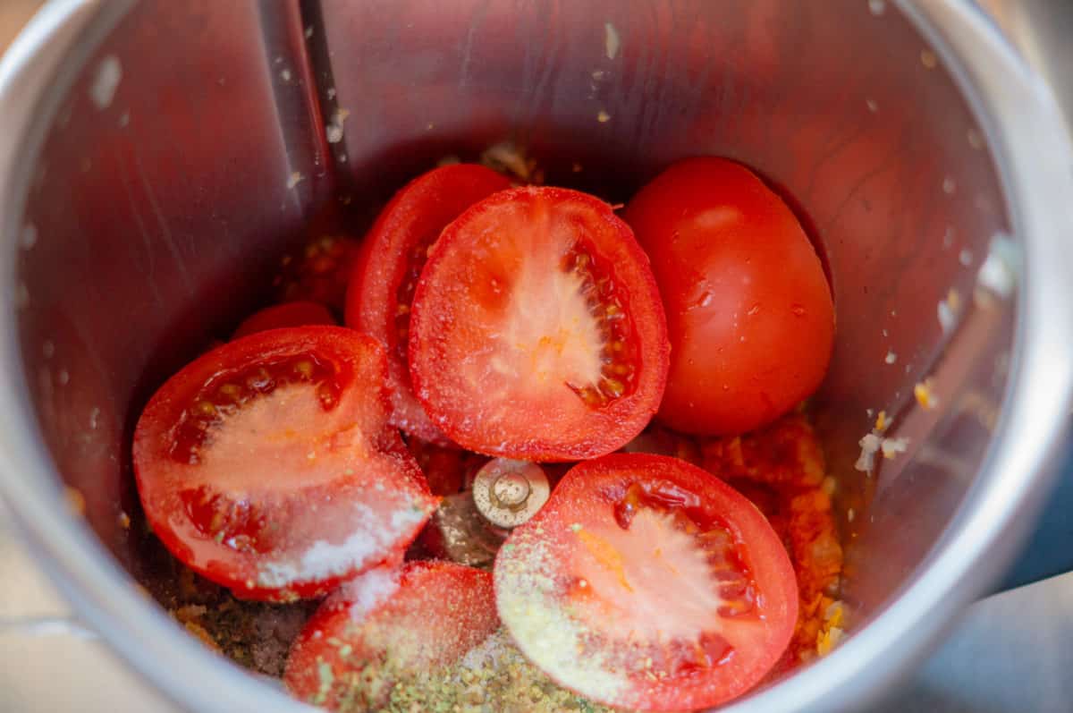 Tomatoes and sauce in the Thermomix® mixing bowl before blending