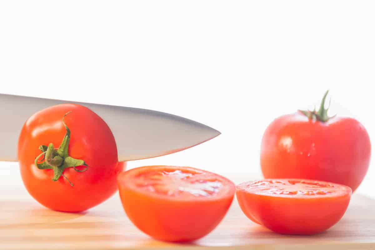 Halving the tomatoes