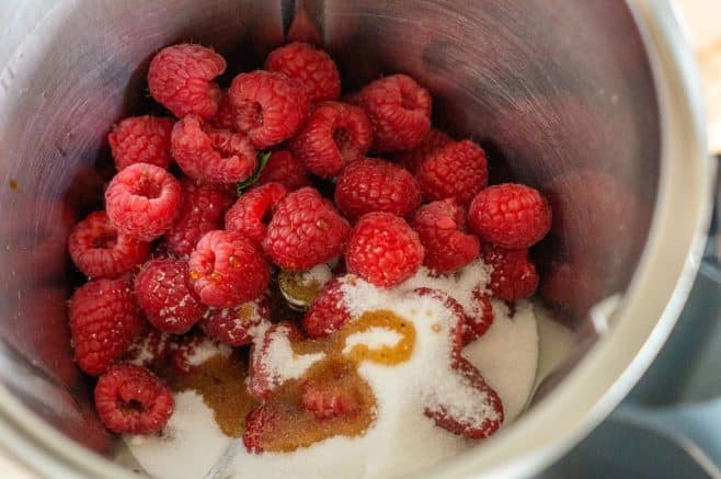 Raspberries, sugar and vanilla extract in the Thermomix® before heating