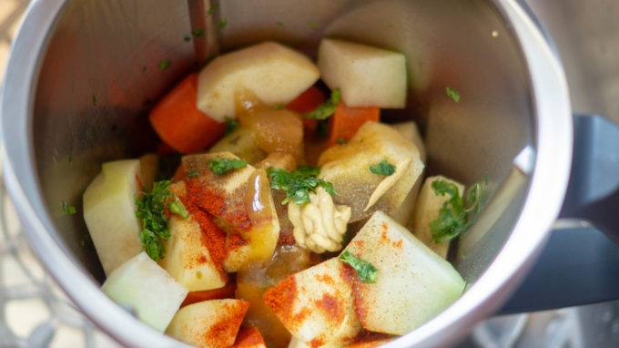 Raw vegetable salad ingredients in the Thermomix® mixing bowl