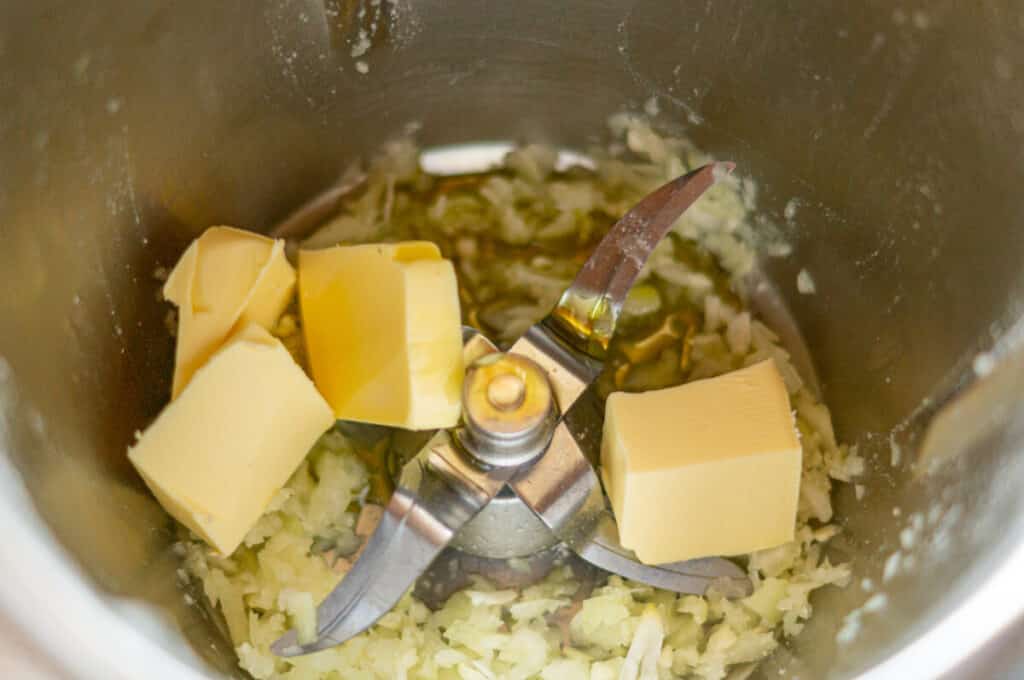 Butter, onions and garlic sweating in the mixing bowl