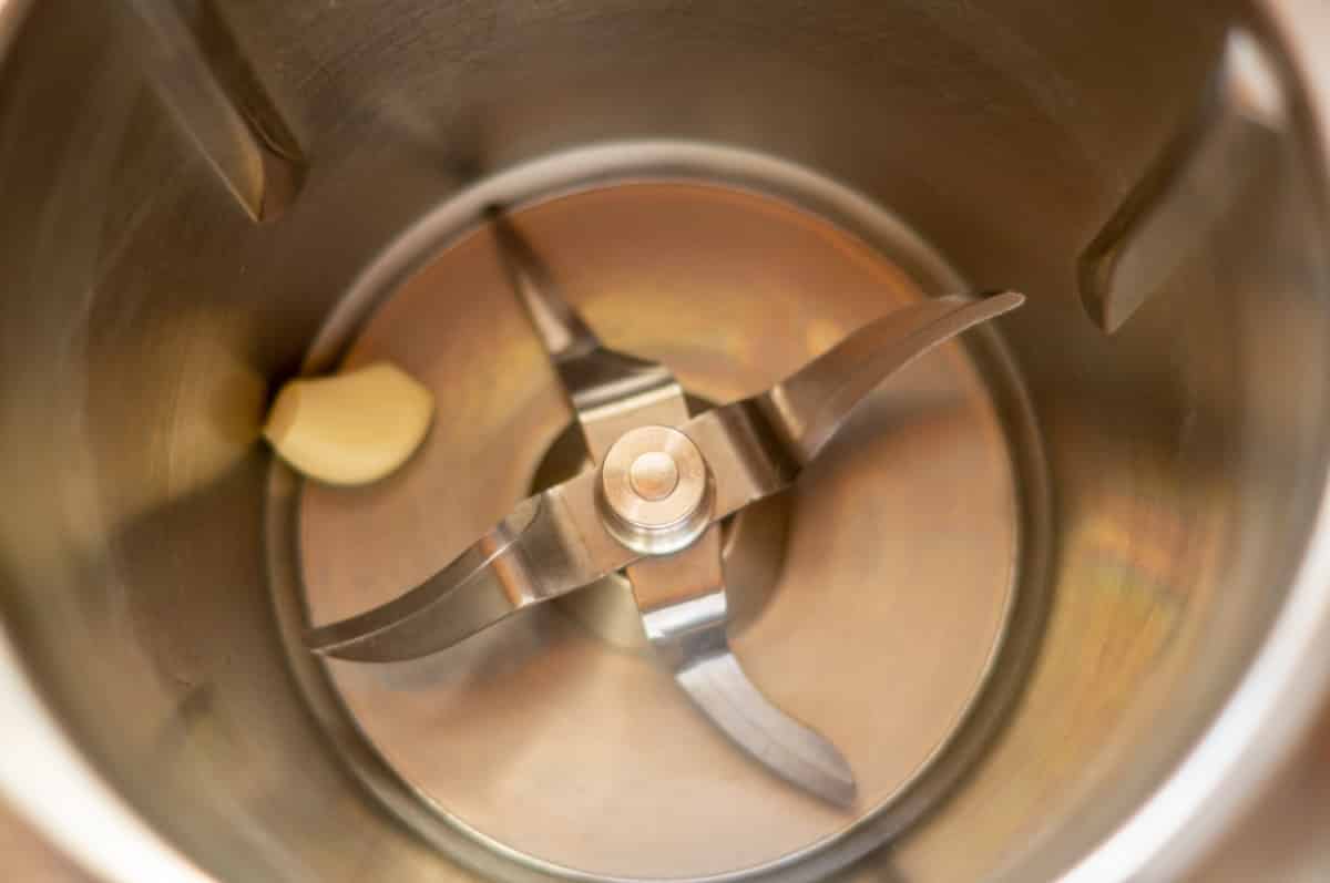 Chopping garlic in the mixing bowl