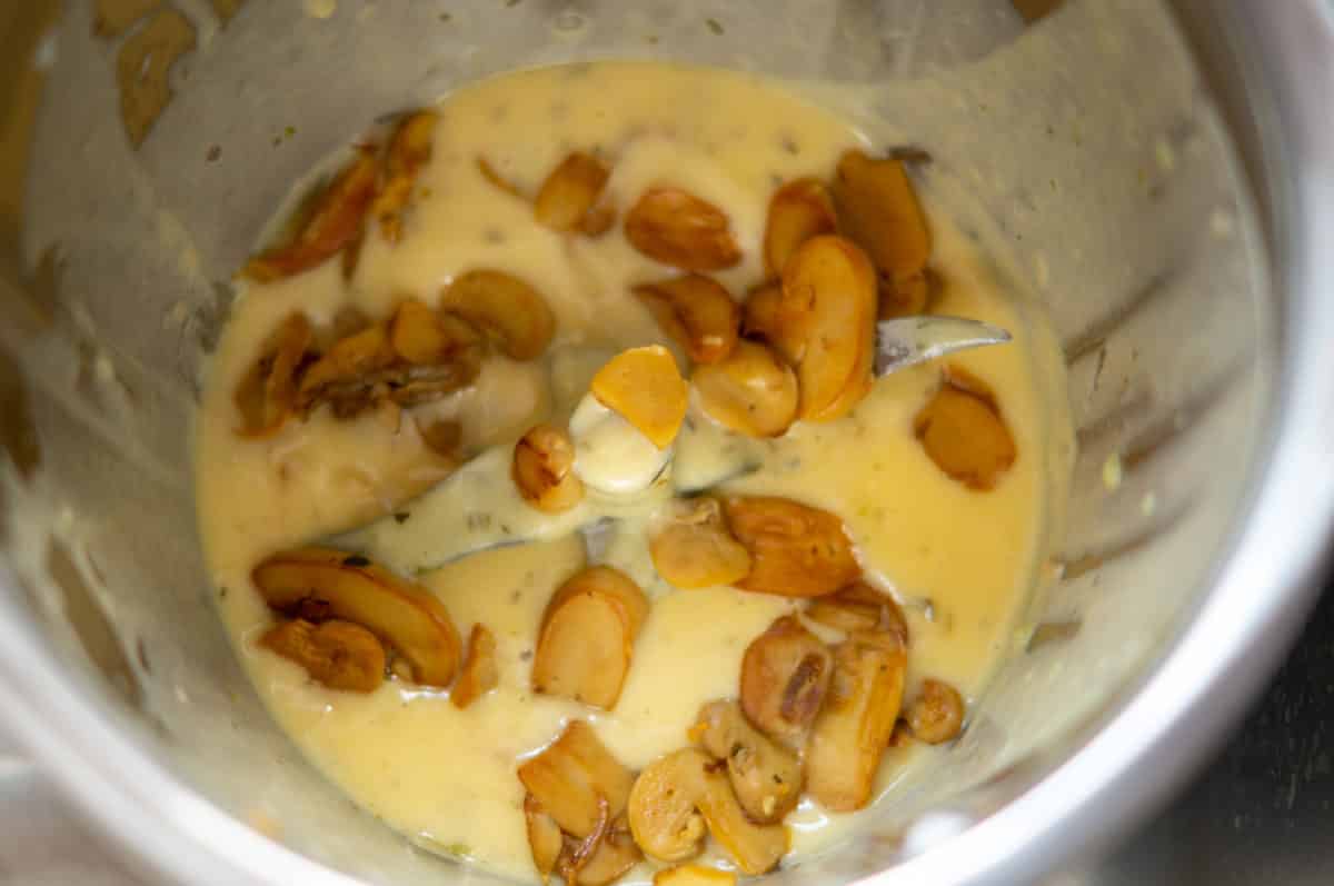 Folding mushrooms into Sauce Hollandaise