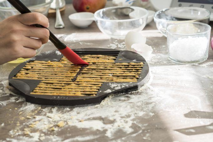 Brushing breadsticks with egg white