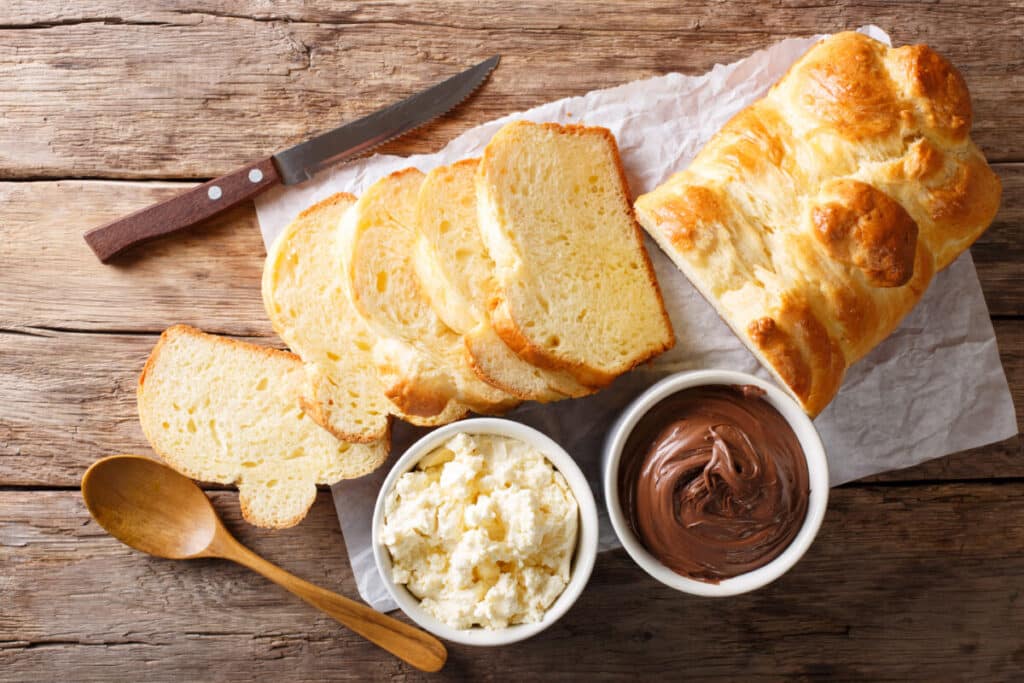 Simple plaited bread made in the Thermomix®, golden brown and baked on a wooden board