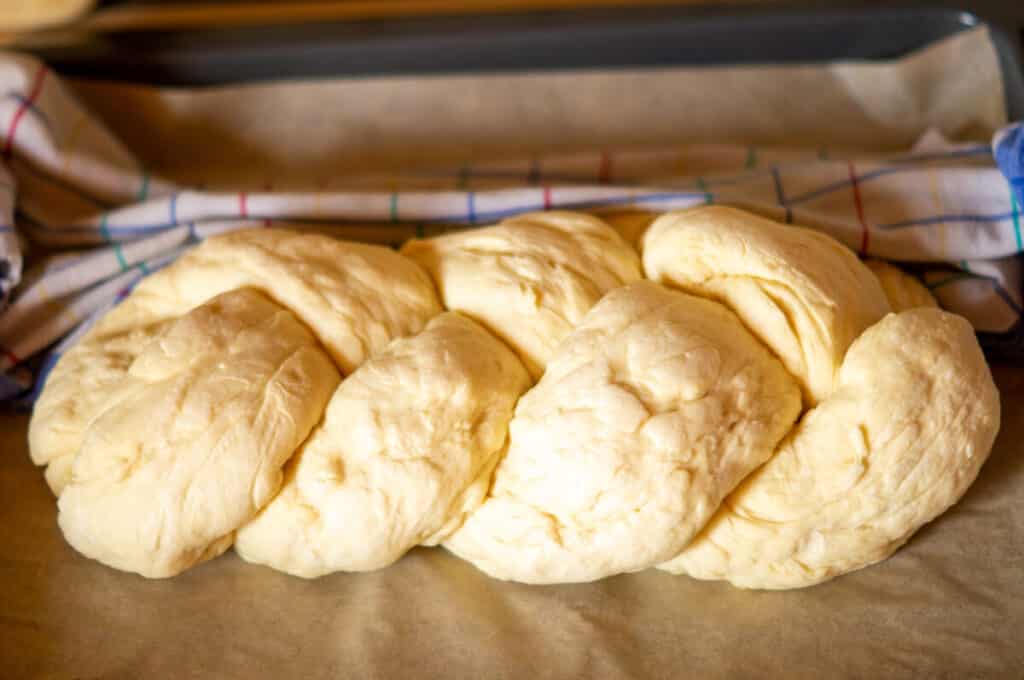 Plaited Thermomix® loaf before baking, resting on the baking tray