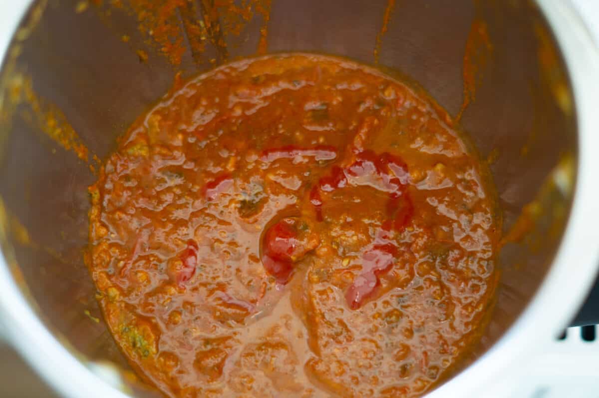 Tomato and date chutney ingredients cooking in the mixing bowl