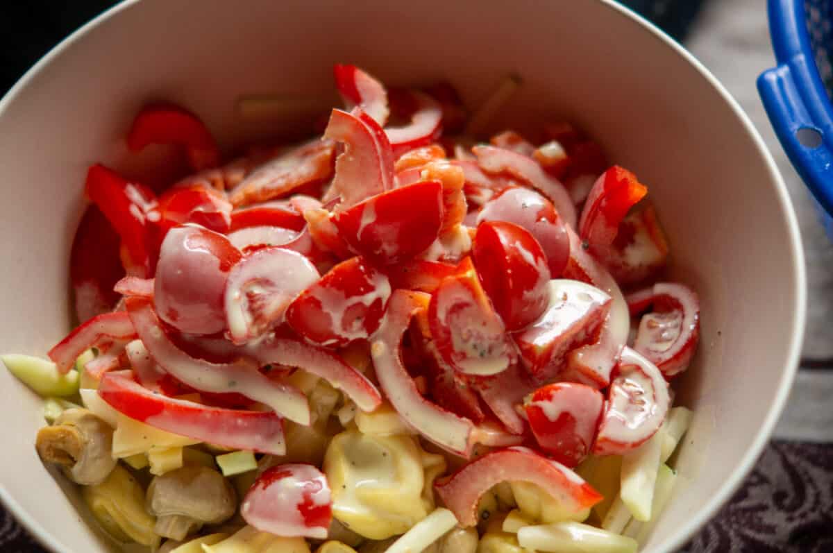 Adding all ingredients to the salad bowl