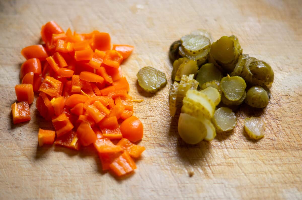 Chopping pepper and gherkins for the pasta salad