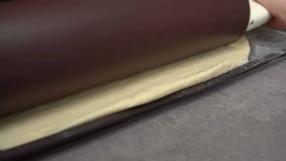 Rolling out pizza dough