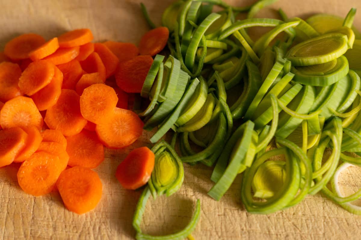 Cutting carrots and leek