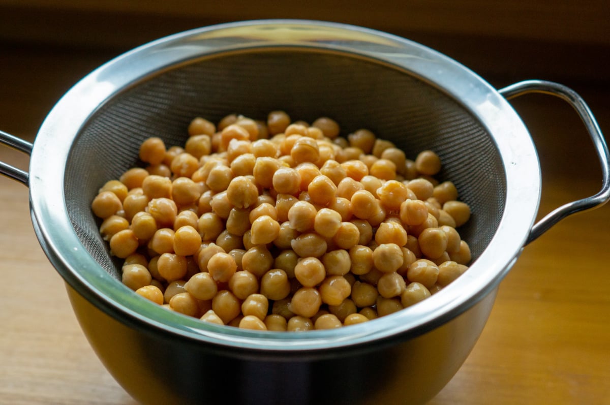 Draining chickpeas from a tin