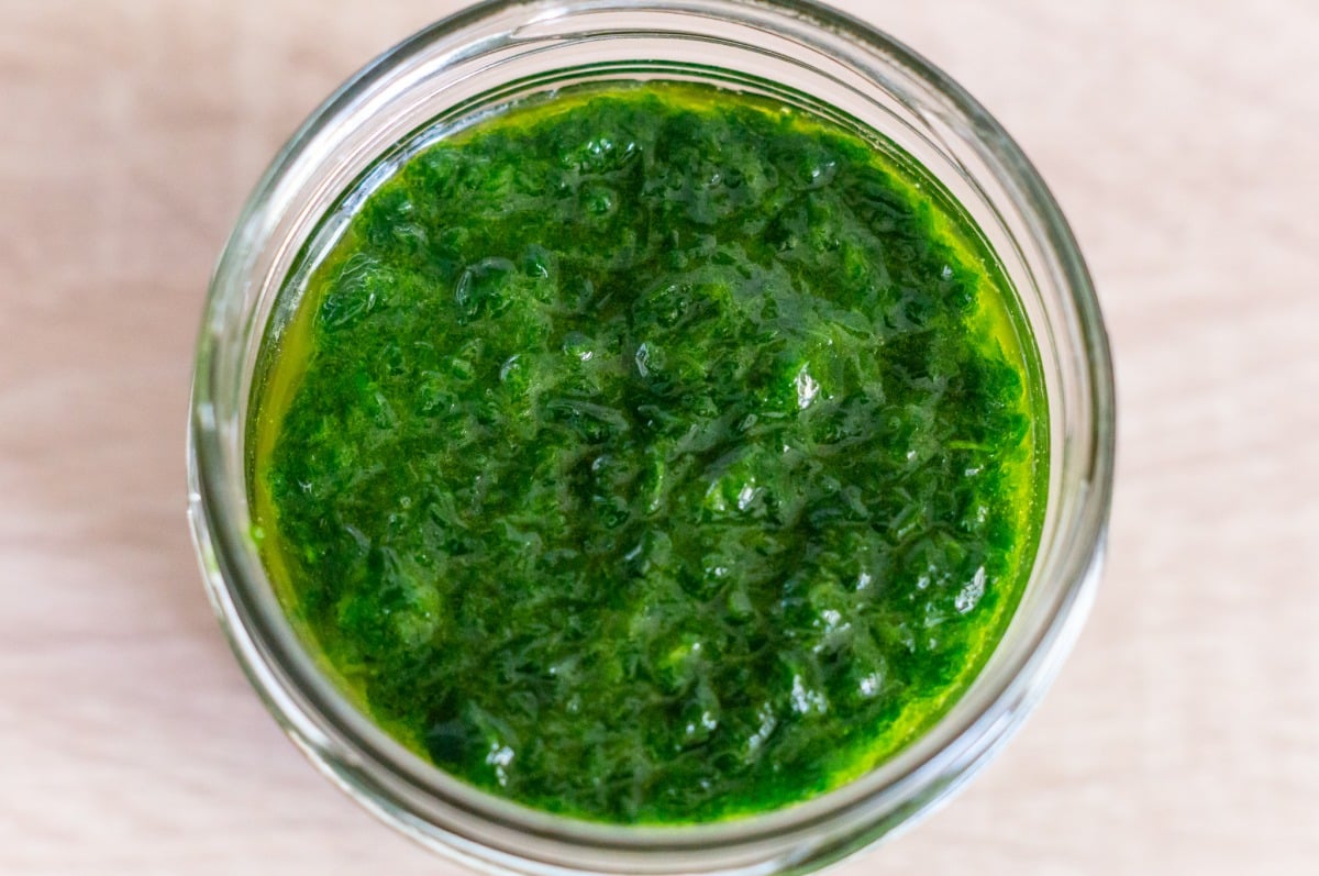 Filling wild garlic paste into a jar