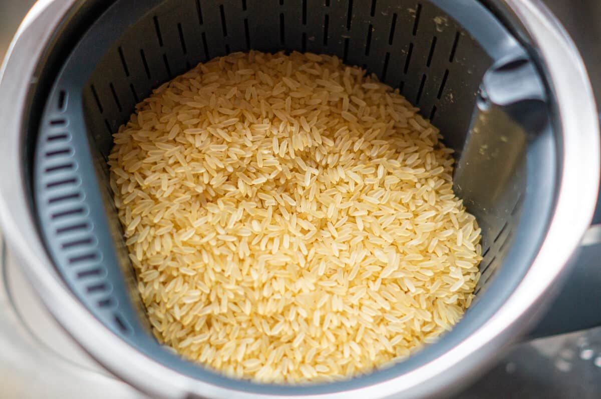 Weighing Thermomix® rice into the steamer basket