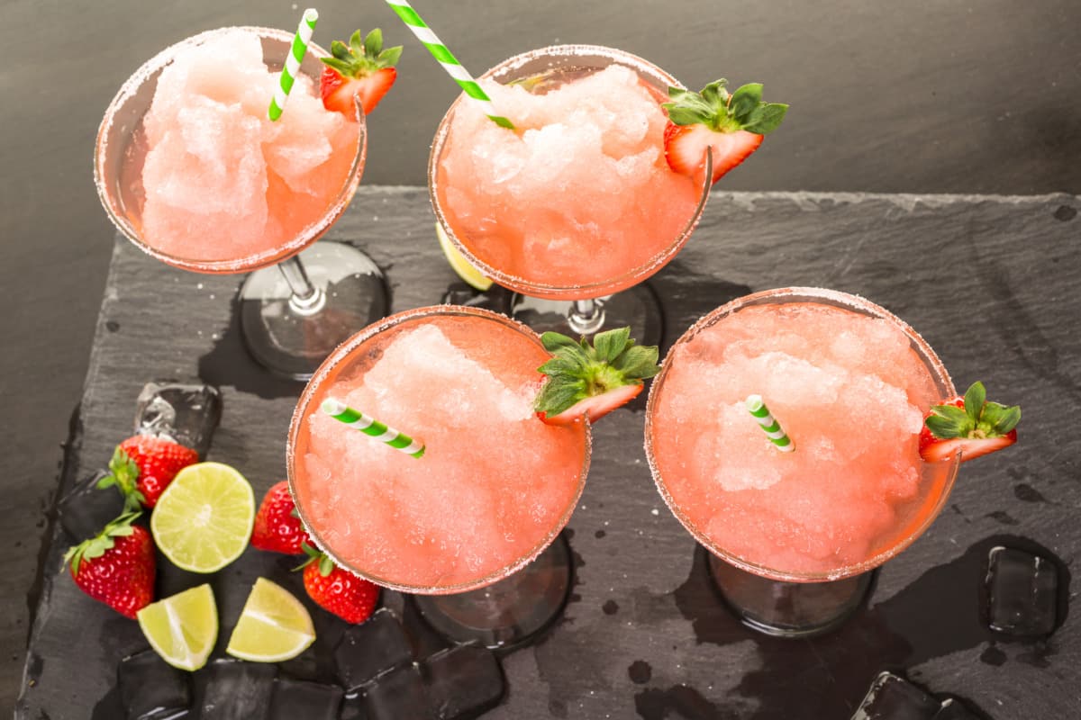 Wine Slush with the Thermomix® in a glass with strawberries and lime